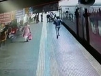 The image, taken from the Twitter video, shows an RPF staff saving life of a woman and her son.