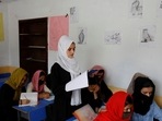 Kerishma Rasheedi, 16, reads during a class at a private school class in Kabul, Afghanistan, August 3, 2022.&nbsp;
