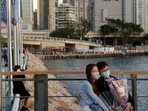 Medical experts say it's okay to support your partner if they have COVID, but it's best not to 'hang out', even if you just recovered from an infection(Lam Yik/REUTERS) Medical experts say it's okay to support your partner if they have COVID, but it's best not to 'hang out', even if you just recovered from an infection(Lam Yik/REUTERS)