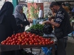 Palestinians buy fresh produce from street stalls in Rafah town in the southern Gaza Strip, as a truce with Israel holds following three days of conflict. (Photo by SAID KHATIB/AFP) Palestinians buy fresh produce from street stalls in Rafah town in the southern Gaza Strip, as a truce with Israel holds following three days of conflict. (Photo by SAID KHATIB/AFP)