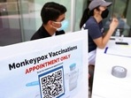 (FILES) Health workers sit at a check-in table at a pop-up monkeypox vaccination clinic.(AFP) (FILES) Health workers sit at a check-in table at a pop-up monkeypox vaccination clinic.(AFP)