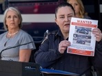 Albuquerque Police Deputy Chief of Investigations Cecily Barker holds a flyer with photos of a car wanted in connection with Muslim men murdered as Governor Michelle Lujan Grisham looks on in Albuquerque, New Mexico. (Adolphe Pierre-Louis/Albuquerque Journal via AP) Albuquerque Police Deputy Chief of Investigations Cecily Barker holds a flyer with photos of a car wanted in connection with Muslim men murdered as Governor Michelle Lujan Grisham looks on in Albuquerque, New Mexico. (Adolphe Pierre-Louis/Albuquerque Journal via AP)