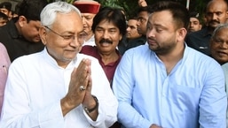 RJD leader Tejashwi Yadav and JDU leader Nitish Kumar interact with the media after meeting Bihar governor Phagu Chauhan to form a new government in Patna, Bihar.&nbsp;