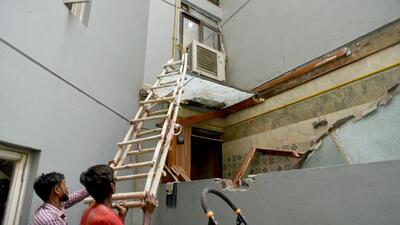 Noida Authority workers demolish an illegal structure built by Shrikant Tyagi in Noida on Monday. (Sunil Ghosh/ HT) Noida Authority workers demolish an illegal structure built by Shrikant Tyagi in Noida on Monday. (Sunil Ghosh/ HT)