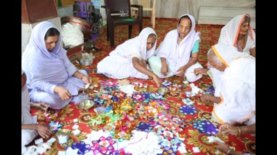 Widows with ‘rakhis’ prepared for the PM at an ashram in Vrindavan. (HT)