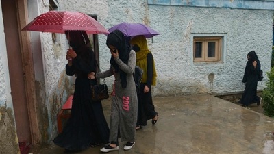Girls arriving in a secret school at an undisclosed location in Afghanistan. (AFP)
