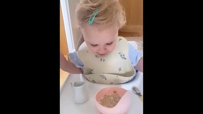 The baby girl gets surprised after pouring milk without spilling it for the first time. (Instagram/@thelittledreameruk) The baby girl gets surprised after pouring milk without spilling it for the first time. (Instagram/@thelittledreameruk)