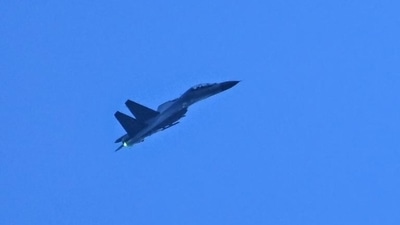A Chinese military jet flies over Pingtan island, one of mainland China's closest points to Taiwan, in Fujian province on Saturday. (AFP) A Chinese military jet flies over Pingtan island, one of mainland China's closest points to Taiwan, in Fujian province on Saturday. (AFP)