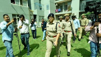 Police personnel at Omaxe Grand housing society in Noida on Monday. (Sunil Ghosh/ HT) Police personnel at Omaxe Grand housing society in Noida on Monday. (Sunil Ghosh/ HT)