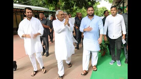 RJD’s Tejashwi Yadav with JDU leader Nitish Kumar in Patna on Tuesday. (Santosh Kumar/HT Photo)