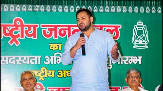 Rashtriya Janata Dal leader Tejashwi Yadav speaks as Janata Dal (United) leader Nitish Kumar and JDU national president Lalan Singh look on during a meeting, in Patna on Tuesday. (PTI)