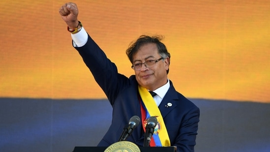 Colombia's new President Gustavo Petro gestures after delivering a speech during his inauguration ceremony at Bolivar Square in Bogota. (Photo by Juan BARRETO/AFP)