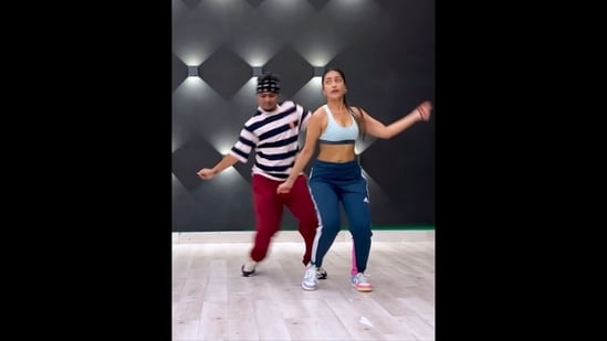 A screengrab from the viral dance video that shows Dhanashree Verma grooving with choreographer Ravi Soni to Telugu hit.(Instagram/@dhanashree9)