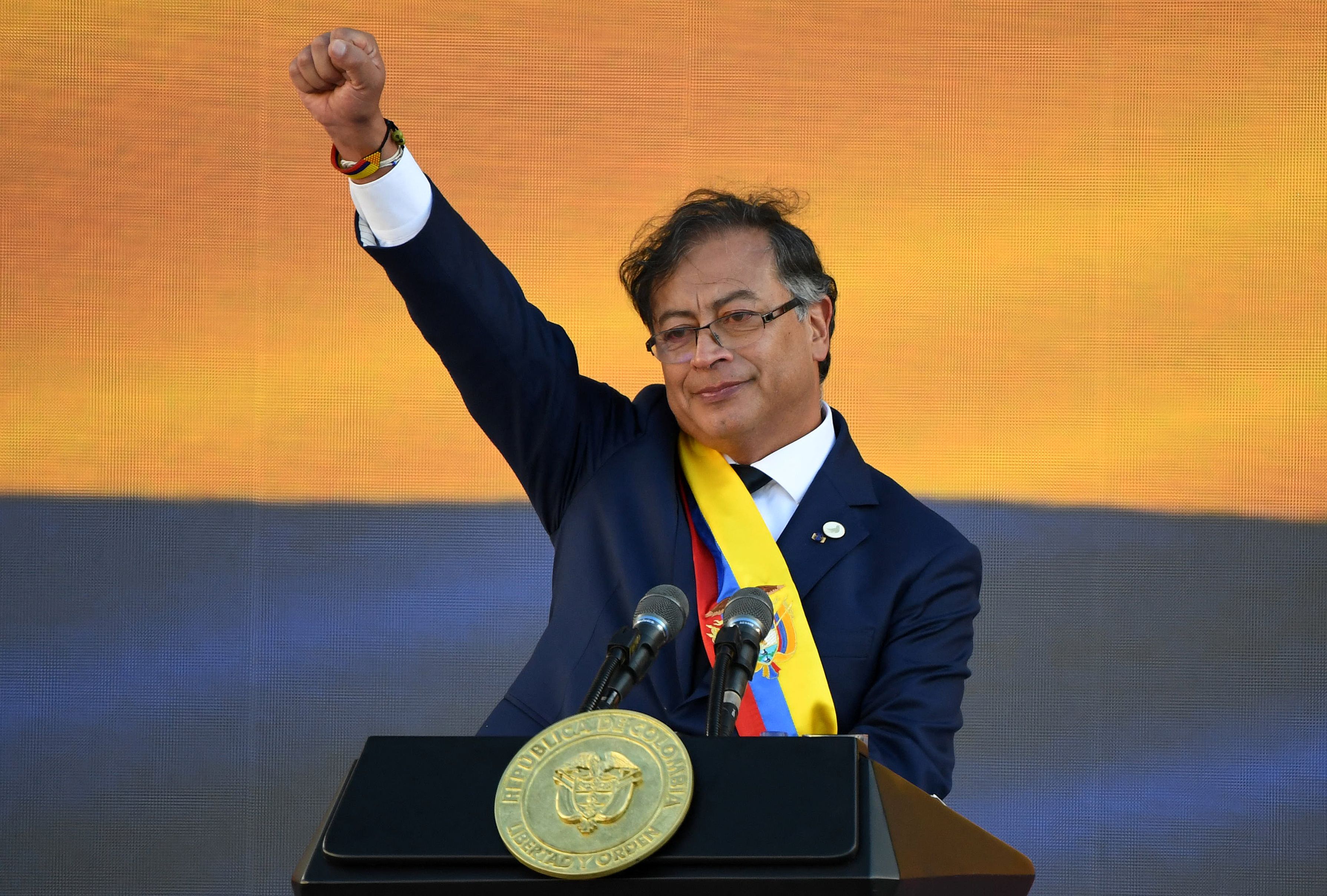 Colombia's new President Gustavo Petro gestures after delivering a speech during his inauguration ceremony at Bolivar Square in Bogota. (Photo by Juan BARRETO/AFP) Colombia's new President Gustavo Petro gestures after delivering a speech during his inauguration ceremony at Bolivar Square in Bogota. (Photo by Juan BARRETO/AFP)