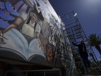Mexican mural artist Yanet Calderon paints on the facade of a municipal building in San Salvador, Mexico, (AP Photo/Fernando Llano)(AP) Mexican mural artist Yanet Calderon paints on the facade of a municipal building in San Salvador, Mexico, (AP Photo/Fernando Llano)(AP)