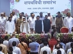 Maharashtra CM Eknath Shinde, deputy CM Devendra Fadnavis, Governor Bhagat Singh Koshyari and the newly-sworn in ceremony of the state cabinet held at Raj Bhavan in Mumbai, India, on Tuesday, August 9, 2022. (Photo by Satish Bate/Hindustan Times) Maharashtra CM Eknath Shinde, deputy CM Devendra Fadnavis, Governor Bhagat Singh Koshyari and the newly-sworn in ceremony of the state cabinet held at Raj Bhavan in Mumbai, India, on Tuesday, August 9, 2022. (Photo by Satish Bate/Hindustan Times)