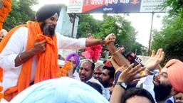Shiromani Akali Dal (SAD) leader Bikram Singh Majithia waves to the crowd as he comes out of the jail after Punjab and Haryana High Court granting bail to him in connection with a case registered against him under the NDPS Act in December 2021, in Patiala on Wednesday. (Rajesh Sachar)