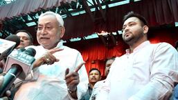 Bihar chief minister Nitish Kumar with Tejashwi Yadav after taking oath again at Raj Bhawan in Patna on Wednesday. (ANI)