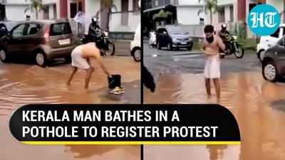 KERALA MAN BATHES IN A POTHOLE TO REGISTER PROTEST