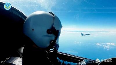 An Air Force pilot navigates an aircraft next to a fighter jet under the Eastern Theatre Command of China's People's Liberation Army (PLA) during military exercises in the waters and airspace around Taiwan, at an undisclosed location on Tuesday. (REUTERS) An Air Force pilot navigates an aircraft next to a fighter jet under the Eastern Theatre Command of China's People's Liberation Army (PLA) during military exercises in the waters and airspace around Taiwan, at an undisclosed location on Tuesday. (REUTERS)