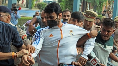Shrikant Tyagi, accused of abusing woman, arrested from Meerut and brought to Noida Police Commissioner's office, in Noida. (ANI Photo) Shrikant Tyagi, accused of abusing woman, arrested from Meerut and brought to Noida Police Commissioner's office, in Noida. (ANI Photo)