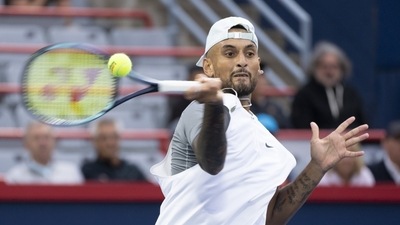 Nick Kyrgios, of Australia, returns to Sebastian Baez, of Argentina, during first round play at the National Bank Open tennis tournament (AP)
