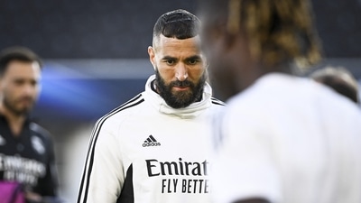 Real Madrid's French forward Karim Benzema looks down during a training session one day prior to the UEFA Super Cup football match. (AFP) Real Madrid's French forward Karim Benzema looks down during a training session one day prior to the UEFA Super Cup football match. (AFP)