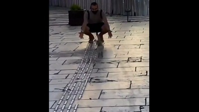 The image, taken from the Reddit video, shows the cat running towards the human. (Reddit/@RIPbyEugenics)