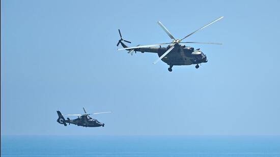 Chinese military helicopters fly past Pingtan island, one of mainland China's closest points from Taiwan, in Fujian province on August 4, 2022. (AFP)