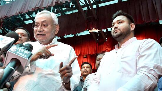 Bihar chief minister Nitish Kumar with Tejashwi Yadav after taking oath again at Raj Bhawan in Patna on Wednesday. (ANI)