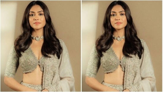 Mrunal decked up in a pastel grey sequined corset-style blouse with a plunging neckline and long sleeves. She teamed it with a long flowy pastel grey skirt with sequined details all throughout.(Instagram/@mrunalthakur)