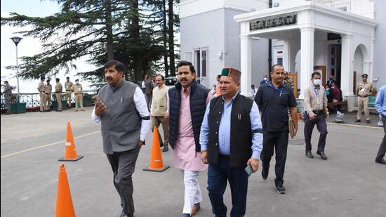 Leader of opposition in Himachal assembly Mukesh Agnihotri, along with Congress MLAs Vikramaditya Singh and Vinay Kumar, outside the Vidhan Sabha on the first day of its monsoon session, in Shimla on Wednesday. (Deepak Sansta/HT)