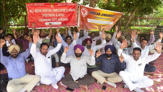 All-India Postal Employees’ Union members protesting over the alleged privatisation of postal service by the Union government outside the postal office in Ludhiana. (Gurpreet Singh/HT)