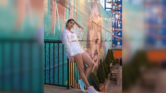 Pooja Hegde struck some cool poses for the camera in the fair in front of a giant wheel and New Yorkers.(Instagram/@hegdepooja)
