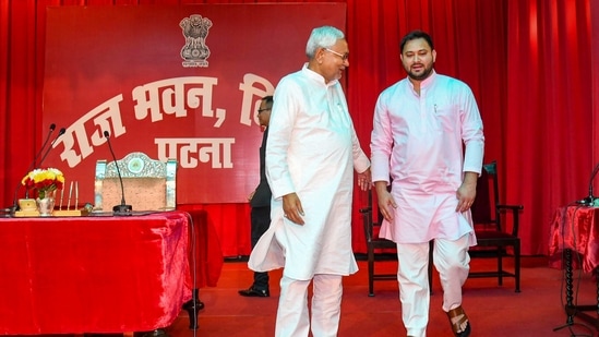 Bihar chief minister Nitish Kumar with deputy chief minister Tejashwi Yadav during the oath taking oath, at Raj Bhavan in Patna, Wednesday, August 10, 2022. (PTI Photo)