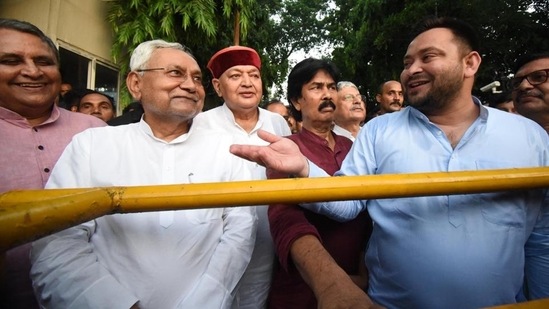 RJD leader Tejashwi Yadav and JD(U) leader Nitish Kumar in Patna on Tuesday.&nbsp;(HT_PRINT)