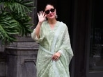 Kareena Kapoor waves at paparazzi.