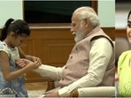 Prime Minister Narendra Modi celebrates Raksha Bandhan with young girls.