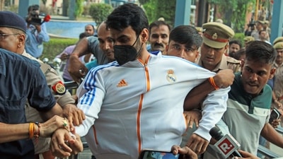Shrikant Tyagi, accused of abusing woman, arrested from Meerut and brought to Noida Police Commissioner's office, in Noida. (ANI Photo) Shrikant Tyagi, accused of abusing woman, arrested from Meerut and brought to Noida Police Commissioner's office, in Noida. (ANI Photo)