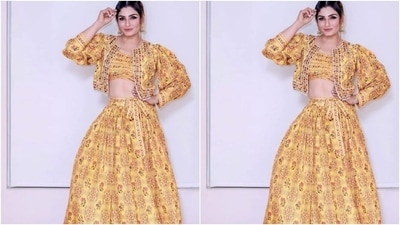 Styled by fashion stylist Surina Kakkar, Raveena wore her tresses into a clean bun with braids and decked up in black eyeliner, black kohl, mascara-laden eyelashes, drawn eyebrows, contoured cheeks and a shade of nude lipstick. (Instagram/@officialraveenatandon)