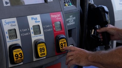 A customer pumps gas at an Exxon gas station in Miami. (AP) A customer pumps gas at an Exxon gas station in Miami. (AP)