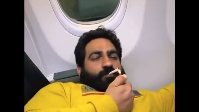 Screenshot from the viral video of Bobby Kataria smoking inside a plane.&nbsp;