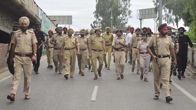 Police commissioner Kaustubh Sharma along with others police officials during the flag march at Jagraon Bridge ahead of Independence Day in Ludhiana. (Gurpreet Singh/HT)