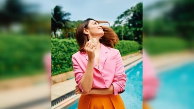 Tamannaah Bhatia gets her hair flip moment on point with a small flower in her hand and a smile on her face. (Instagram/@stylebyami) Tamannaah Bhatia gets her hair flip moment on point with a small flower in her hand and a smile on her face. (Instagram/@stylebyami)