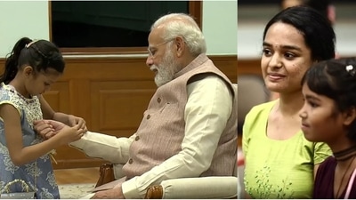 Prime Minister Narendra Modi celebrates Raksha Bandhan with young girls. Prime Minister Narendra Modi celebrates Raksha Bandhan with young girls.