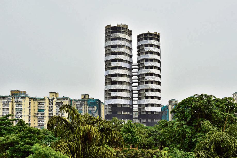 Over 3,500kg of explosives will be filled within 9,400 holes drilled in the columns and shears of the nearly 100m-tall twin towers. Over 3,500kg of explosives will be filled within 9,400 holes drilled in the columns and shears of the nearly 100m-tall twin towers.