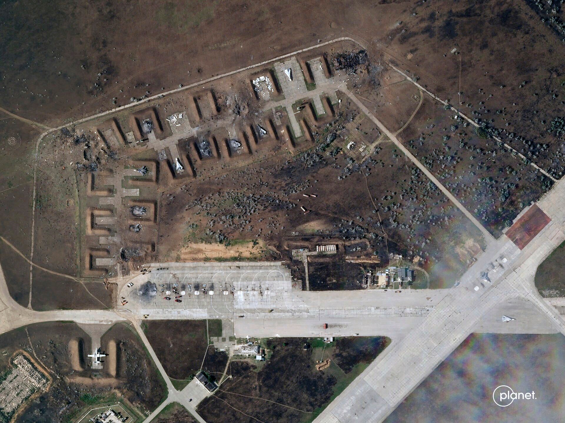 This satellite image provided by Planet Labs PBC shows destroyed Russian aircraft at Saki Air Base after an explosion Tuesday, August 9, 2022, in the Crimean Peninsula, the Black Sea peninsula seized from Ukraine by Russia and annexed in March 2014. (Planet Labs PBC via AP) (AP)