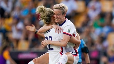 United States' Kristie Mewis, left, and Megan Rapinoe celebrate their side's third goal scored by Ashley Sanchez against Costa Rica during a CONCACAF Women's Championship&nbsp; (AP)