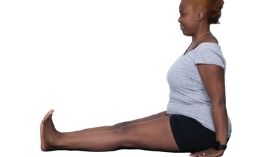 4. Dandasana or Staff Pose - Sit down on the ground and begin with Sukhasana. Ensure that your back is erect. Stretch your legs out in front of you. Your legs must be parallel to each other and toes should be pointed upwards. Tighten the muscles of your pelvis, thighs and calves. Align your head in such a way that the crown faces the ceiling and the focus of your gaze is forward. This will automatically straighten and lengthen your spine. Place your palms beside your hips on the floor. This will support your spine and also relax your shoulders. Hold the asana for a while. (Twitter/UKIYENGARYOGA) 4. Dandasana or Staff Pose - Sit down on the ground and begin with Sukhasana. Ensure that your back is erect. Stretch your legs out in front of you. Your legs must be parallel to each other and toes should be pointed upwards. Tighten the muscles of your pelvis, thighs and calves. Align your head in such a way that the crown faces the ceiling and the focus of your gaze is forward. This will automatically straighten and lengthen your spine. Place your palms beside your hips on the floor. This will support your spine and also relax your shoulders. Hold the asana for a while. (Twitter/UKIYENGARYOGA)