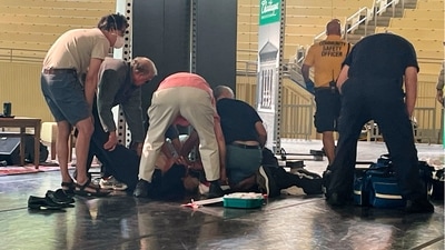 The author was taken or fell to the floor, and the man was restrained. (AP) The author was taken or fell to the floor, and the man was restrained. (AP)
